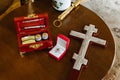 Accessories for the baptism of a child in the church. Cross. holy light. Box with essential oils. Holy water. Evangelia