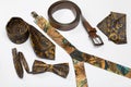 Accessories, belt, bow tie, suspenders, tie and scarf. Shot from above, on a white background