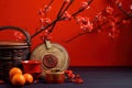 Accessories Chinese new year festival decorations.orange,leaf,wood basket,red packet,plum blossom,teapot on red background. Top Royalty Free Stock Photo