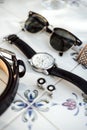 Accessories of an elegant man - watch, cuff links, sun glasses, belt, bow tie Royalty Free Stock Photo