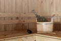 Accessories for the sauna in the wooden sauna. Wooden tub, birch broom in hot steam. Finnish bath Royalty Free Stock Photo