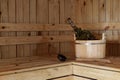 Accessories for the sauna in the wooden sauna. Wooden tub, birch broom in hot steam. Finnish bath Royalty Free Stock Photo