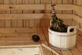 Accessories for the sauna in the wooden sauna. Wooden tub, birch broom in hot steam. Finnish bath Royalty Free Stock Photo