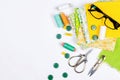 Accessories for sewing and needlework. Fabric, spools of thread, scissors and glasses Royalty Free Stock Photo