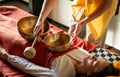 Sound massage, Tibetan singing bowls treatment in spa salon