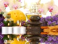 Accessories for spa with orchids, lavender, stones, candles and Royalty Free Stock Photo