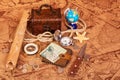 Accessories for the traveler on background of antique maps. Royalty Free Stock Photo