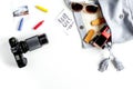 Accessories for treveling with children, camera and toys on white background top view mock-up