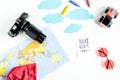 Accessories for treveling with children, camera and toys on white background top view mock-up