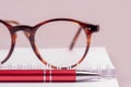 Accessories for work in office, notebook, pen and glasses Royalty Free Stock Photo