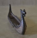 Incense, Accessory for burning incense - Viking ship on Travertine marble table Royalty Free Stock Photo