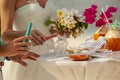 Accessory kit bottles with sand for a wedding in couple hands on the coastline of caribbean sea at summer sunny day Royalty Free Stock Photo