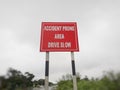 Drive slow, accident prone area sign board on the highway, roadside Royalty Free Stock Photo