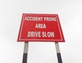 Drive slow, accident prone area sign board on the highway, roadside Royalty Free Stock Photo
