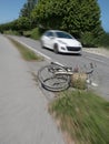 Accident with bicycle and car on highway. Royalty Free Stock Photo