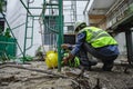 Accident of builder worker in work at construction site. Accident falls from the scaffolding on floor, Foreman support to help the Royalty Free Stock Photo