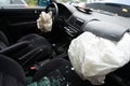 Accident damaged car with opened airbag