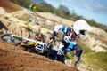 Accident, fitness and man biker on a dirt road for competition, race or training workout. Sports, motorcycle and Royalty Free Stock Photo