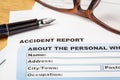 Accident report application form and pen on brown envelope and e Royalty Free Stock Photo