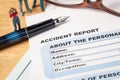 Accident report application form and pen on brown envelope and e Royalty Free Stock Photo