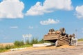 Accident on the road. Overturned truck with sand lies on the ground after a crash.