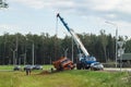 AÃ¢â¬âboom truck hooking and lifting an overturned lorry, Moscow suburbs, Russia.