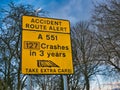 An accident route alert sign in the UK. The sign warns that drivers should take extra care on a dangerous stretch of road. Royalty Free Stock Photo