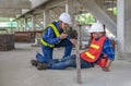 a piece of wood fell from height hit on a worker's legs while working at a new building, a colleague rescue