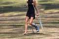 Accident tourist girl are walking by crutches in the garden. Royalty Free Stock Photo