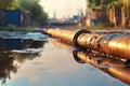 accident on the water supply line. Old rusty metal broken water pine in hole against dark ground and with a puddle of dirty water Royalty Free Stock Photo