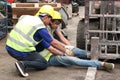 Accident at workplace, industrial engineer worker wearing helmet hit by forklift car at manufacturing plant factory construction Royalty Free Stock Photo