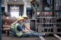 Accident at workplace, industrial engineer worker wearing helmet hit by forklift car at manufacturing plant factory construction Royalty Free Stock Photo