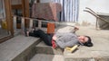 Accidents while cleaning domestic house where a caucasian girl falls off the ladder with broom and dustpan and bucket of water Royalty Free Stock Photo