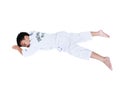 Accidents in sports. Asian child athletes taekwondo lying prone Royalty Free Stock Photo