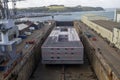 An accommodation barge being renovated in dry dock in Falmouth, Cornwall