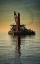 Accommodation barge during sunset at sea Royalty Free Stock Photo