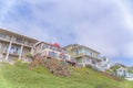 Accommodations on top of a grassy slope with plants and gazebo at Carlsbad, San Diego, California Royalty Free Stock Photo