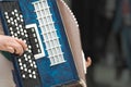 Accordion in the hands of a musician, close-up view. Royalty Free Stock Photo