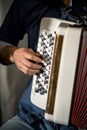 Accordion player close-up playing the white button accordion Royalty Free Stock Photo