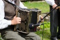 Accordionist man play folk music with accordion Royalty Free Stock Photo