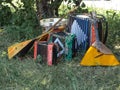 Musical instruments lying on the grass in the shade under the tree Royalty Free Stock Photo