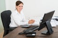 Accountant Doing Calculation At Desk