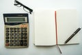 Accountant eyeglasses on office desk during working on budget