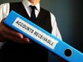 Accountant is holding Accounts Receivable in the folder Royalty Free Stock Photo