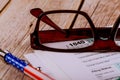 Accountant& x27;s office documents tax form focus on 1040, shallow depth of field with pen, glasses