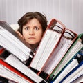 Accountant swamped with financial documents