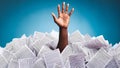 An accountant under a pile of office documents. A human hand emerges from a pit of accounting papers. Concept: accounting report, Royalty Free Stock Photo