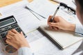 accountant using calculator for calculate budget finance on table in office Royalty Free Stock Photo