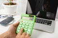 Accountant working and analyzing financial calculating with calculator