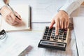 accountant working on desk to using calculator with pen on book Royalty Free Stock Photo